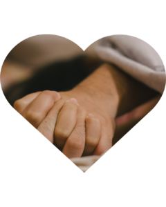 Holding hands inside a heart