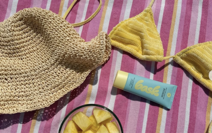 Image of bask sunscreen and beach wear