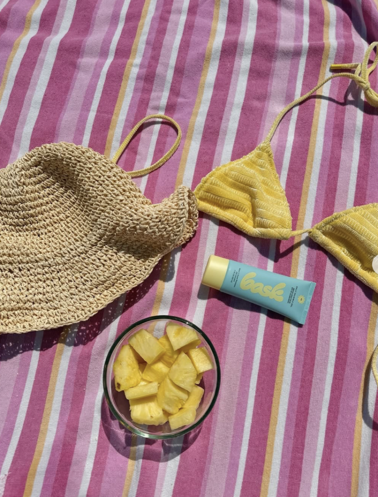 Image of bask sunscreen and beach wear