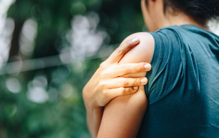 Woman with pain in shoulder and upper arm. Ache in human body, Office syndrome concept.